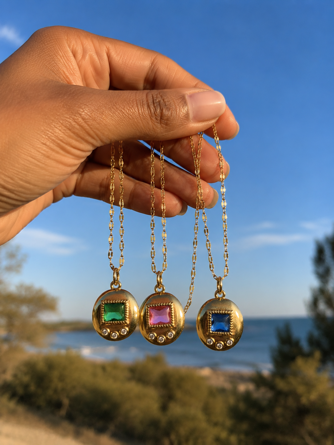 Pink, blue, and green digital pet charm necklaces in gold plating
